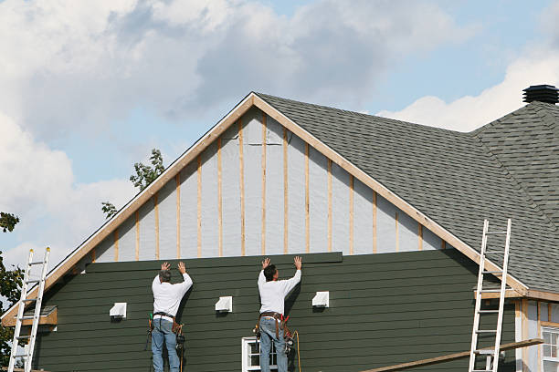 Professional Siding Contractor technician working in Portland, IN